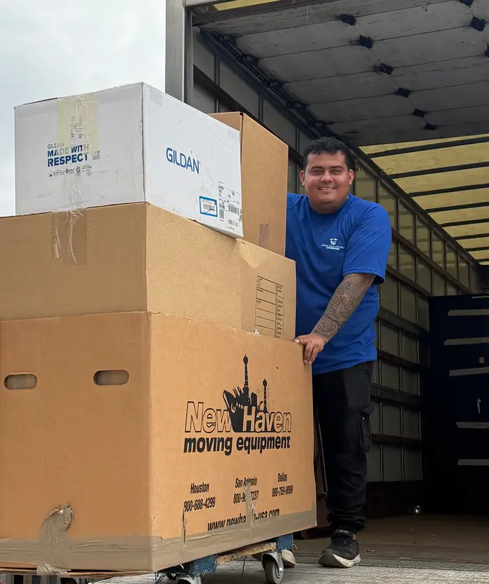Pro Alliance crew member with packed boxes at the truck