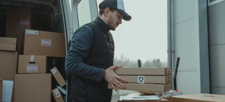 a person carrying boxes