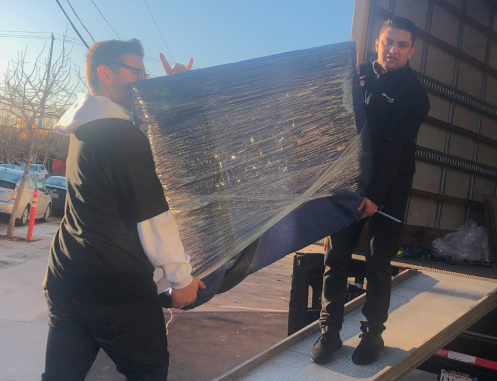 Movers carrying belongings