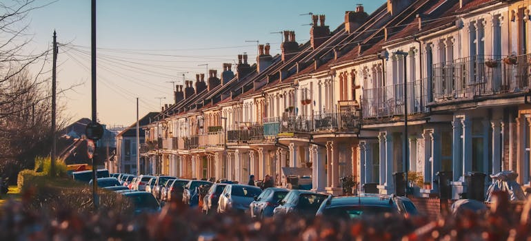 Parked cars in front of the townhouses