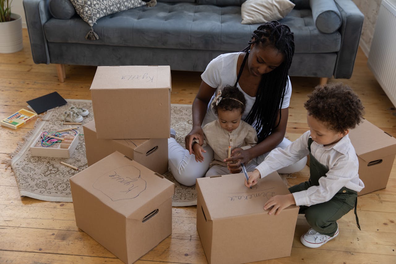 A mother packing for moving with kids to Cibolo