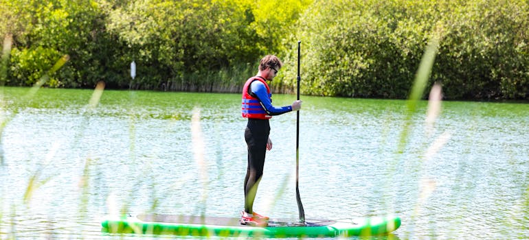 A man paddleboarding