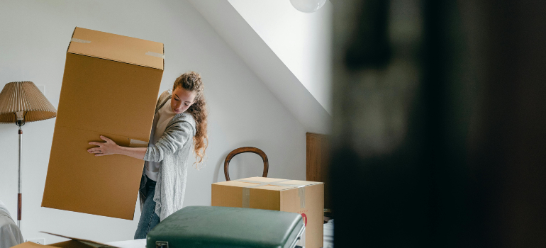 Lifting big boxes alone proves DIY moving isn’t always the smart choice.